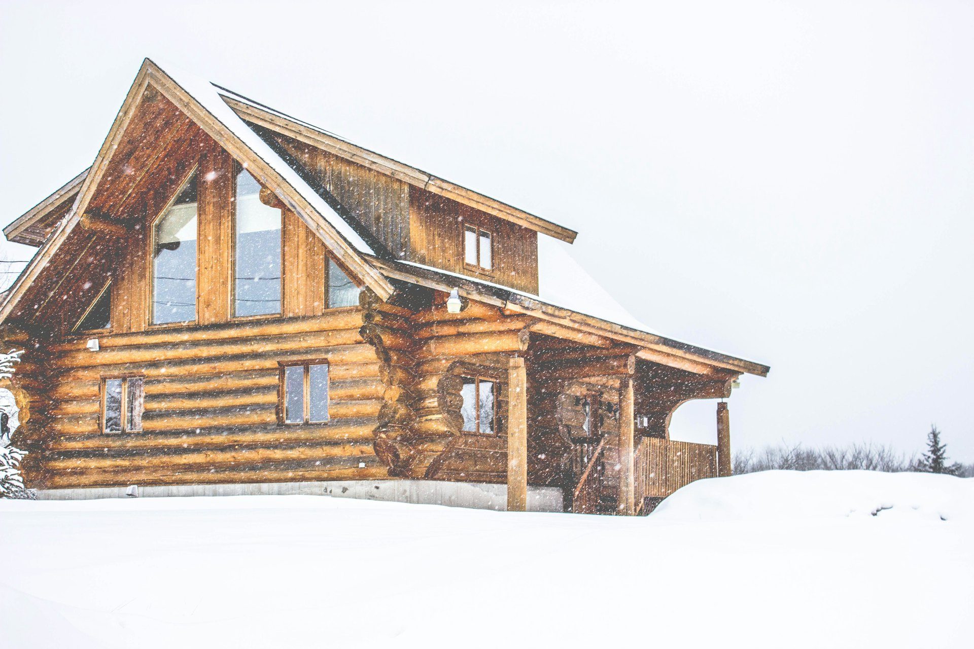 Snow-covered wooden house in winter